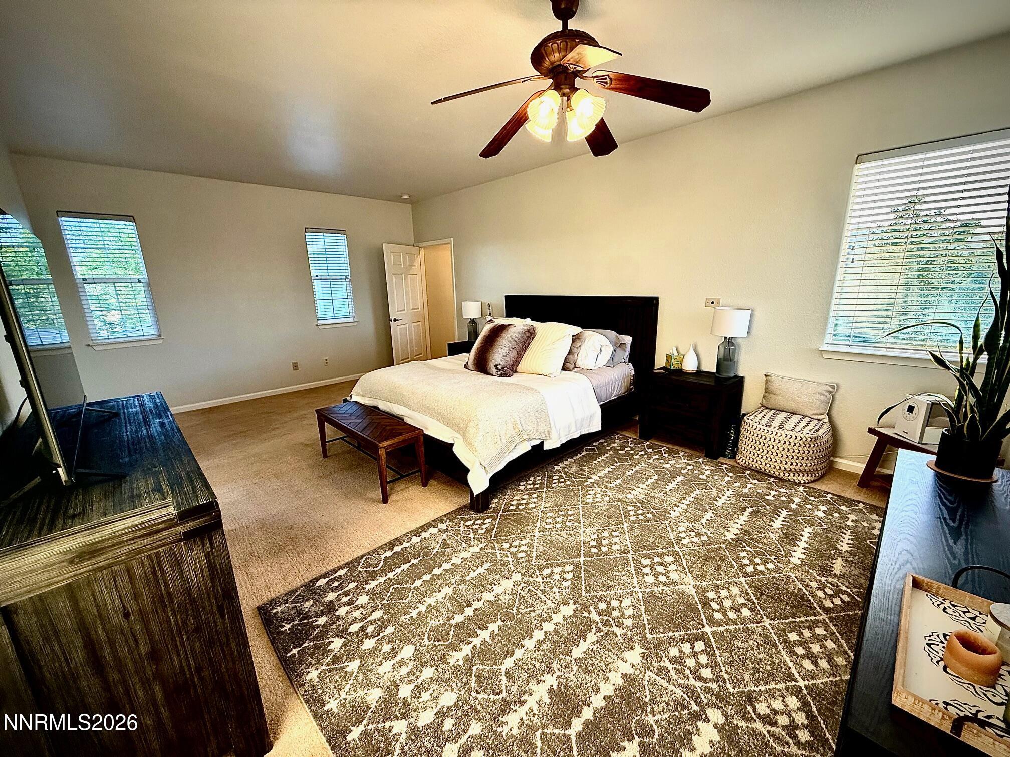 1771 Emerald Bay Drive Reno, NV 89521 - Photo 15 of 31 a bedroom with a bed and wooden floor