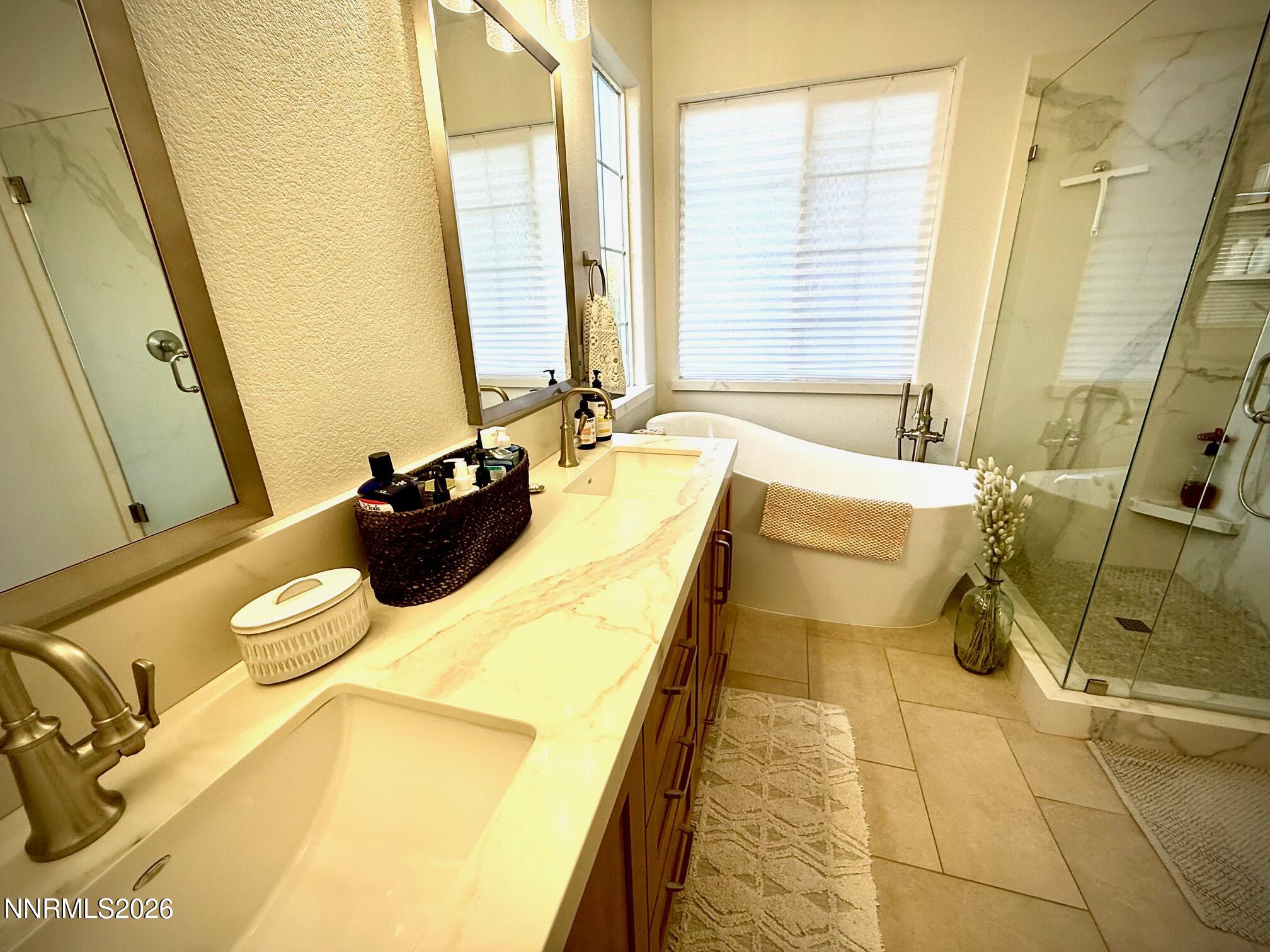 1771 Emerald Bay Drive Reno, NV 89521 - Photo 18 of 31 a bathroom with a tub sink and mirror