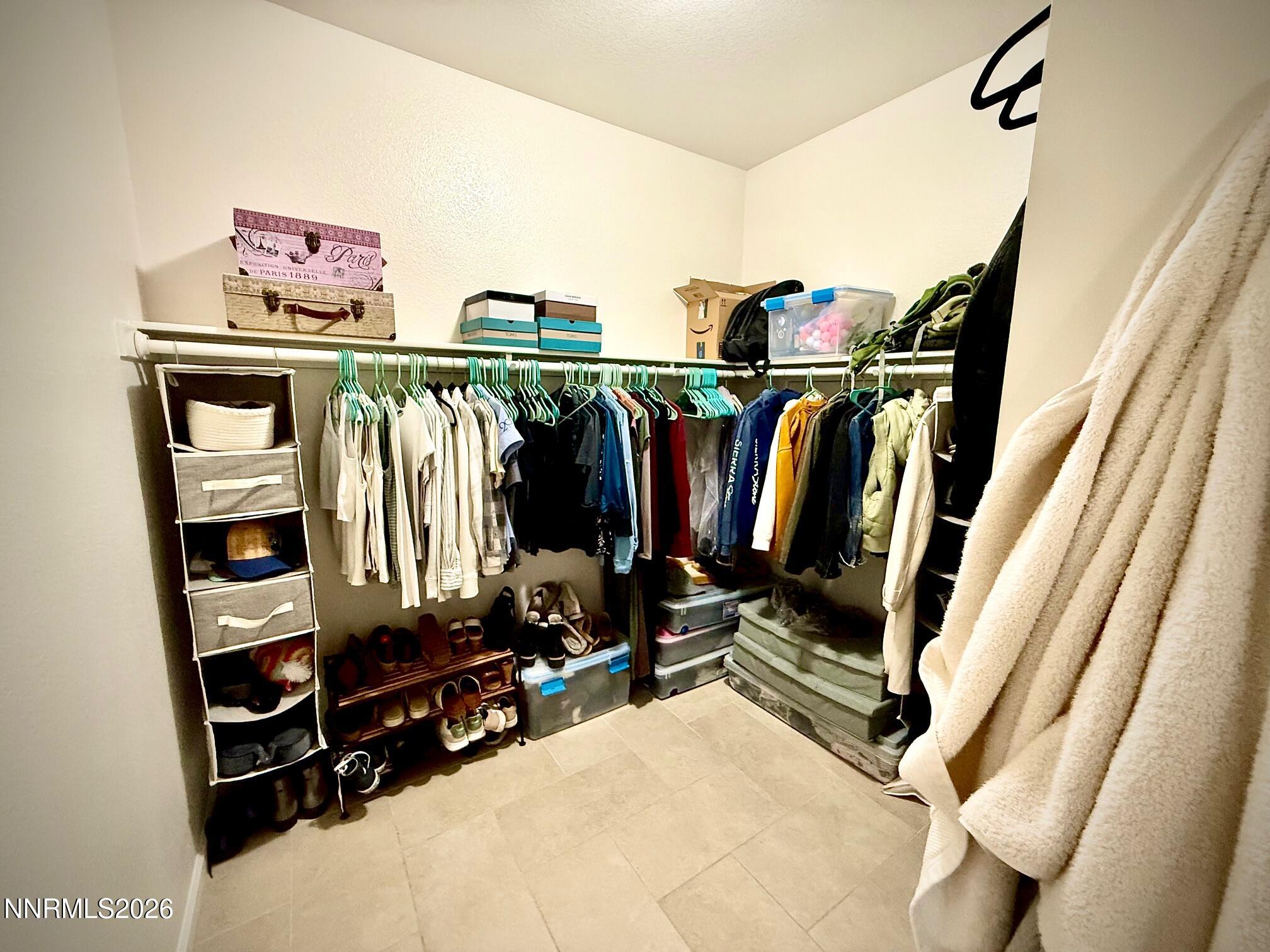 1771 Emerald Bay Drive Reno, NV 89521 - Photo 19 of 31 a view of walk in closet with clothes and shoes