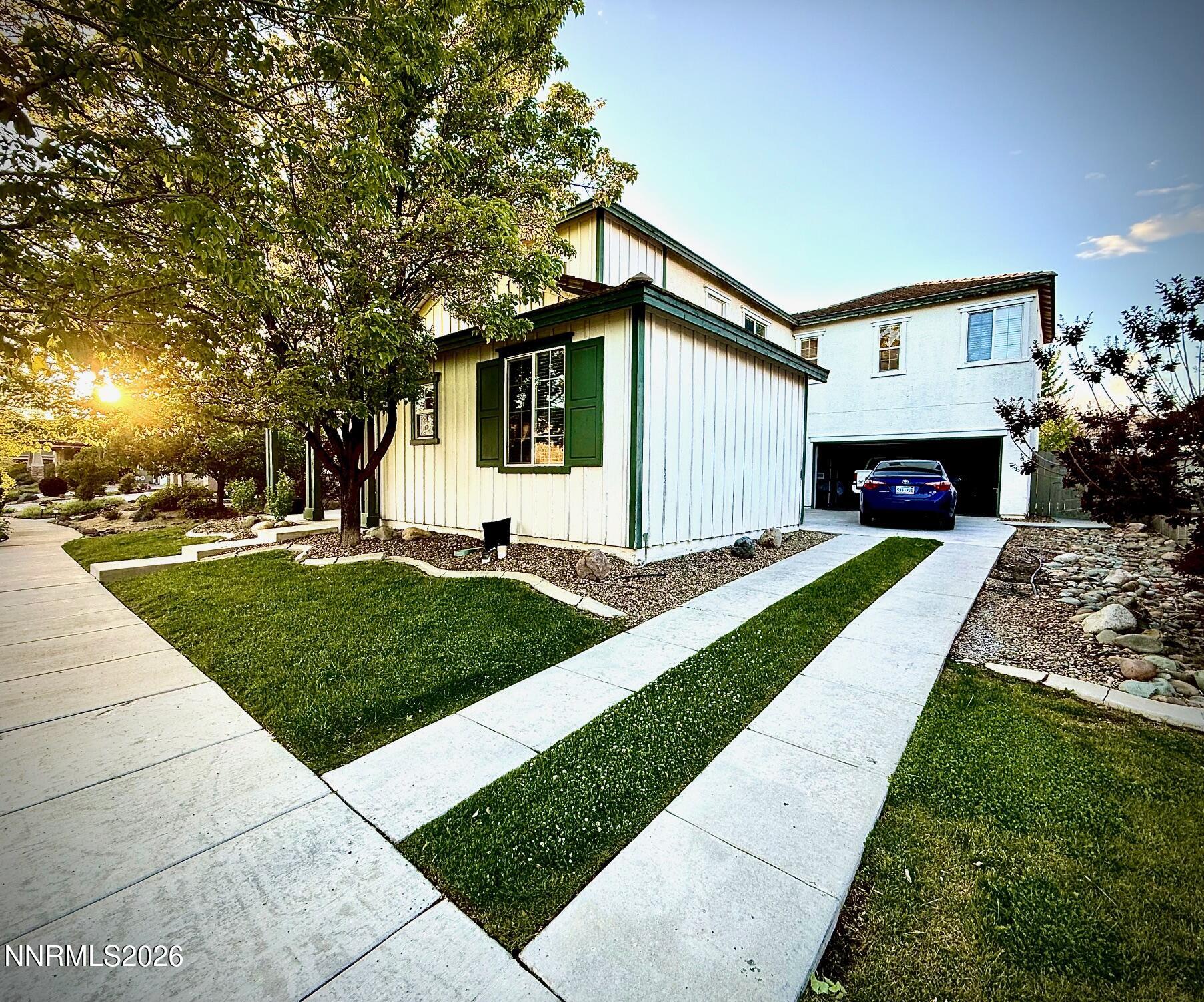 1771 Emerald Bay Drive Reno, NV 89521 - Photo 2 of 31 a front view of a house with a yard and garage