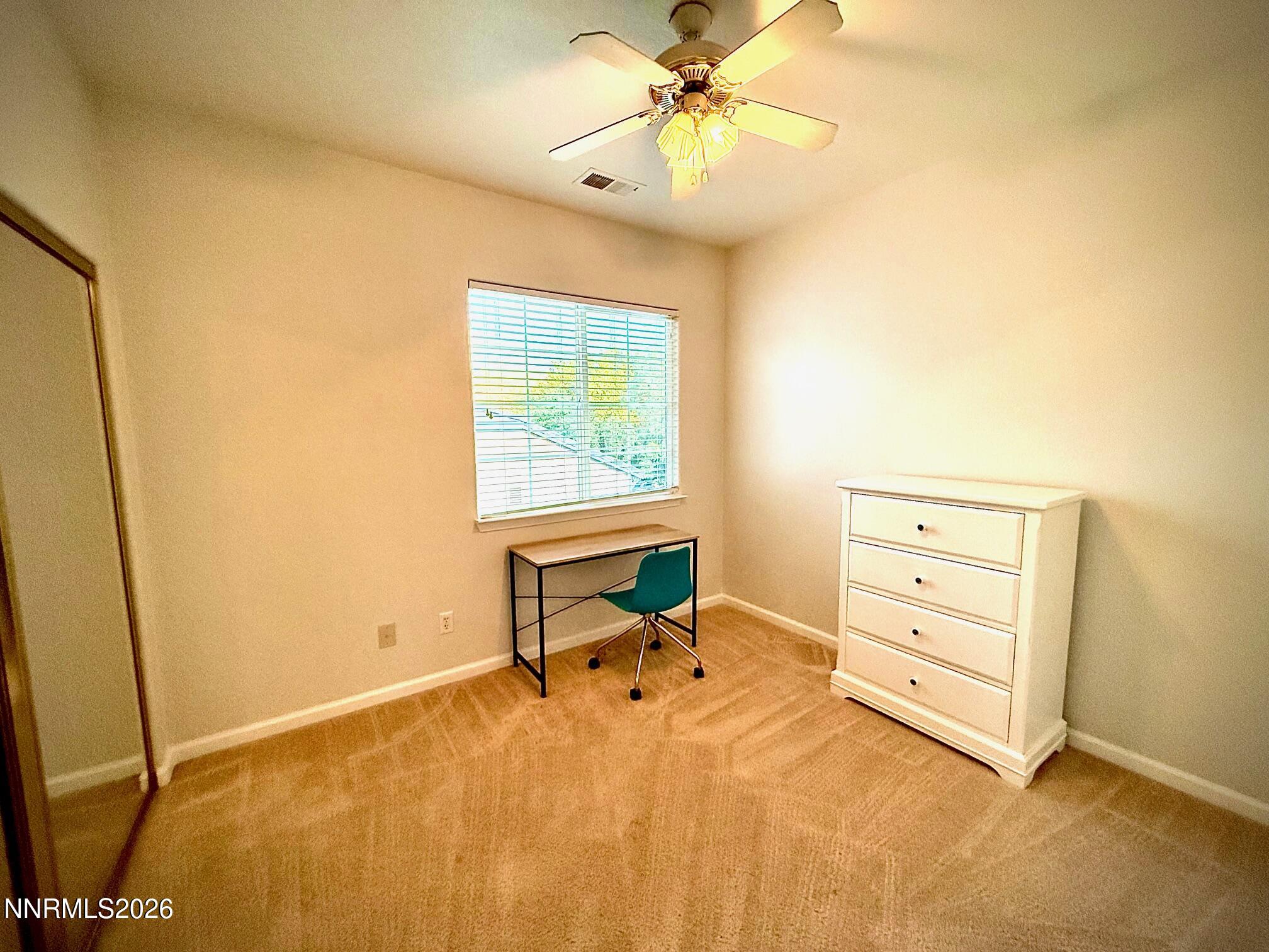 1771 Emerald Bay Drive Reno, NV 89521 - Photo 24 of 31 a bedroom with a bed and wooden floor