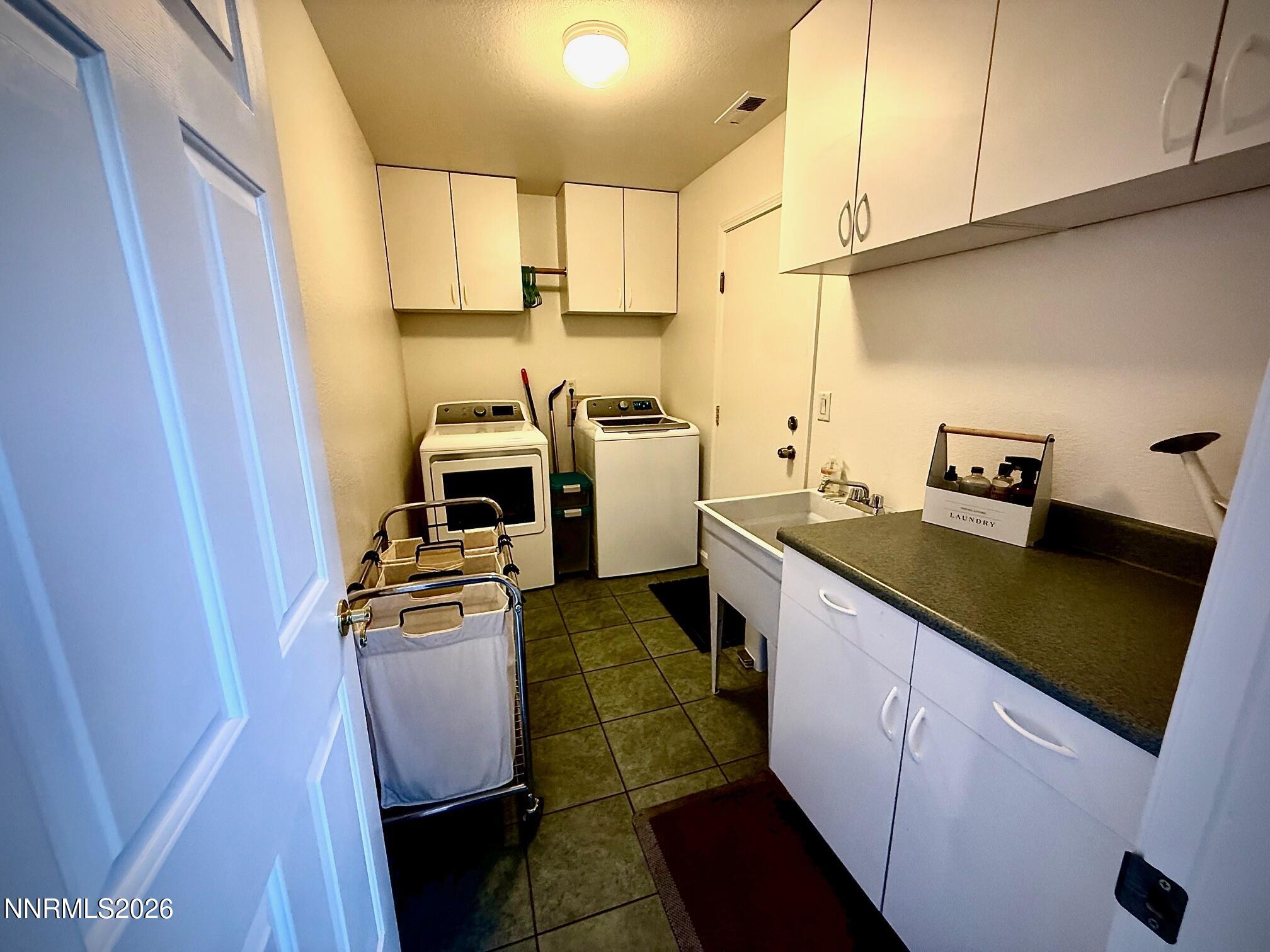 1771 Emerald Bay Drive Reno, NV 89521 - Photo 27 of 31 a kitchen with a sink appliances and cabinets