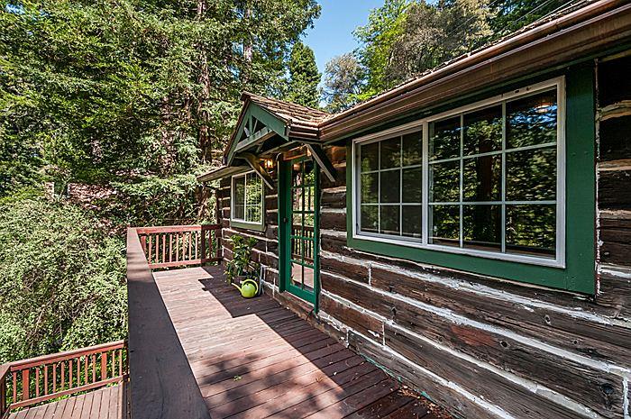 47 Skylonda Drive Woodside, CA 94062 - Photo 16 of 16 a view of a house with a large window and wooden fence
