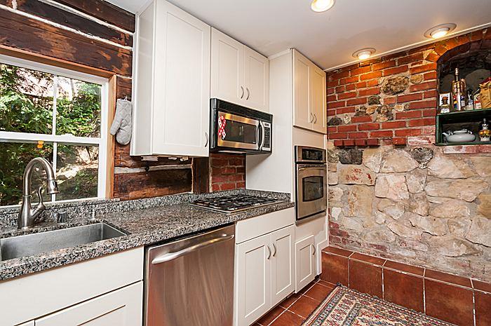 47 Skylonda Drive Woodside, CA 94062 - Photo 10 of 16 a kitchen with stainless steel appliances granite countertop a sink stove and granite counter top