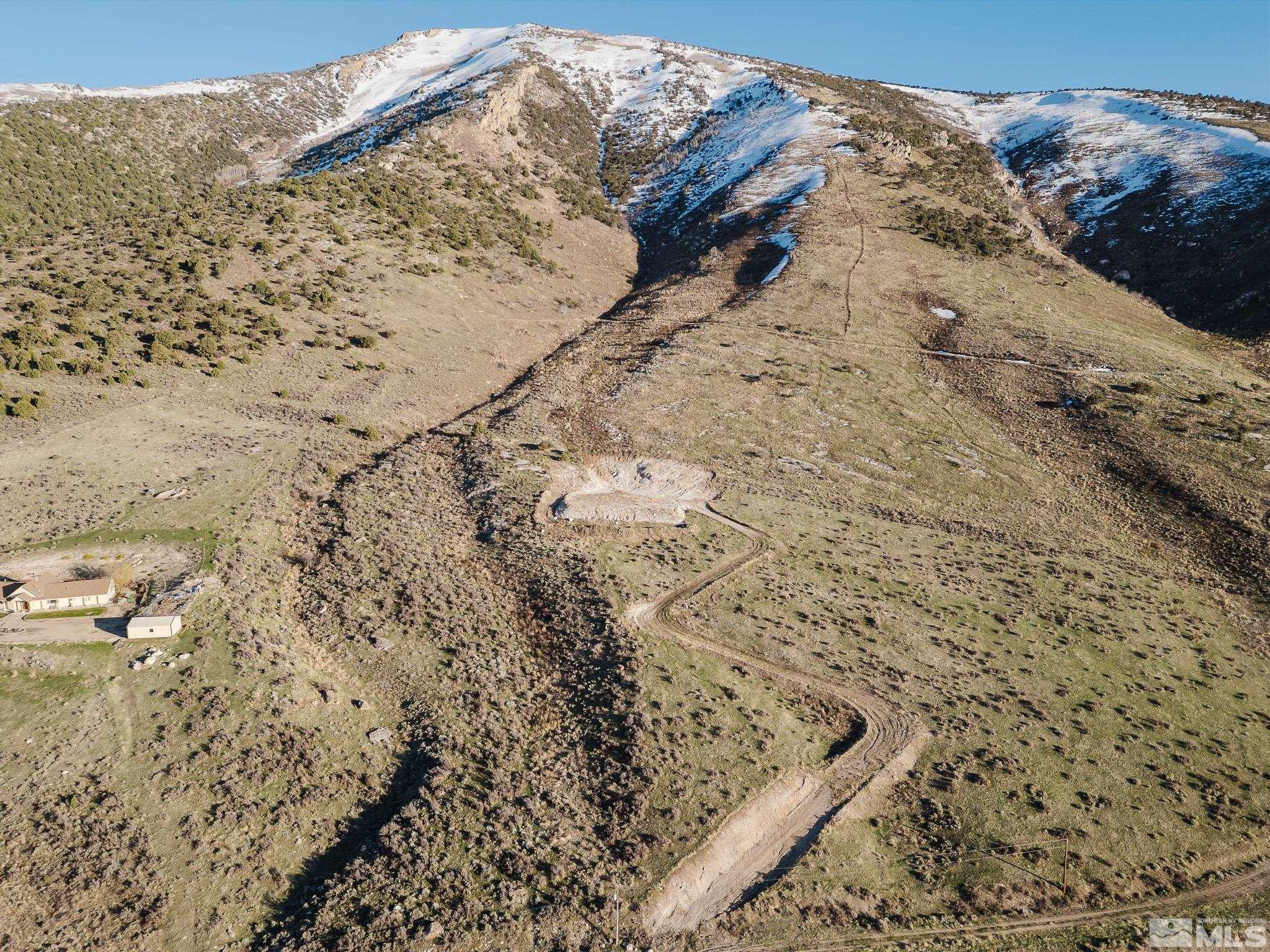 a view of wooden fence of snow