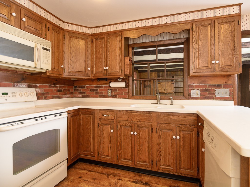 19 8 Lots Road Sutton, MA 01590 - Photo 11 of 30 a kitchen with a sink and cabinets