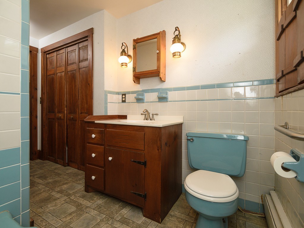 19 8 Lots Road Sutton, MA 01590 - Photo 16 of 30 a bathroom with a sink toilet and mirror