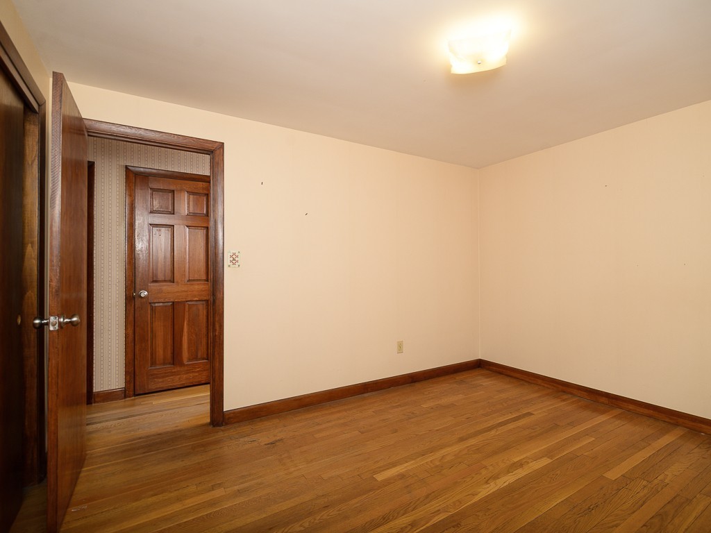 19 8 Lots Road Sutton, MA 01590 - Photo 17 of 30 a view of an empty room with wooden floor and closet