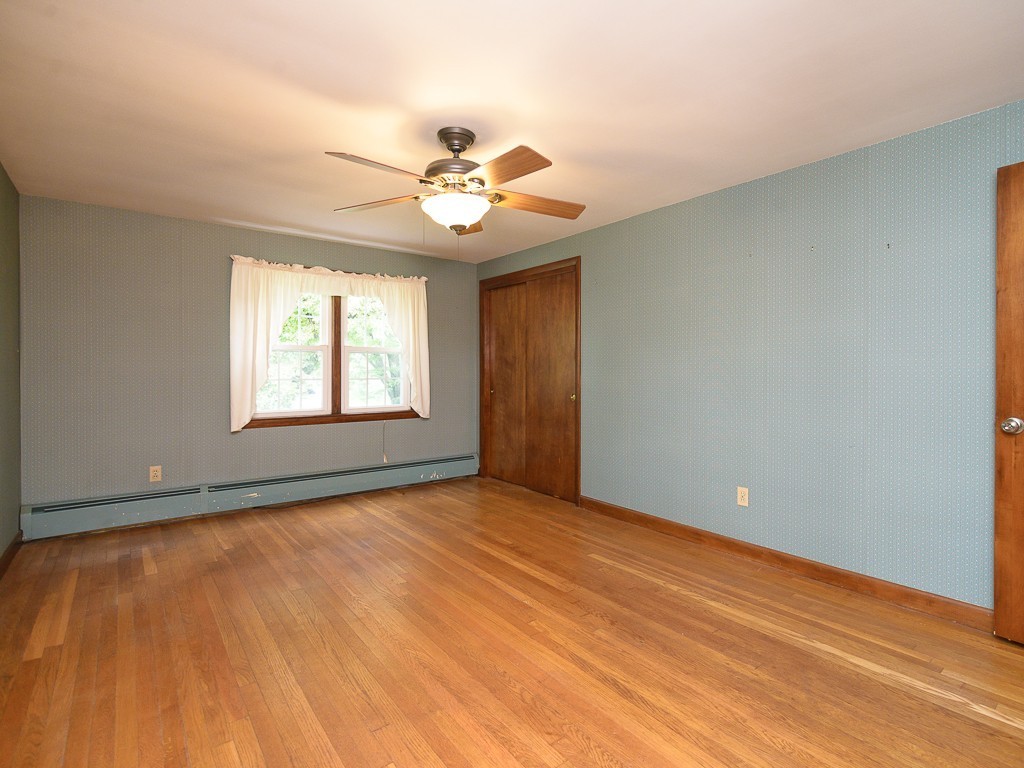 19 8 Lots Road Sutton, MA 01590 - Photo 20 of 30 a view of an empty room with window and chandelier fan