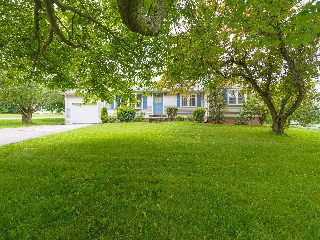19 8 Lots Road Sutton, MA 01590 - Photo 25 of 30 a view of a house with a big yard and large trees