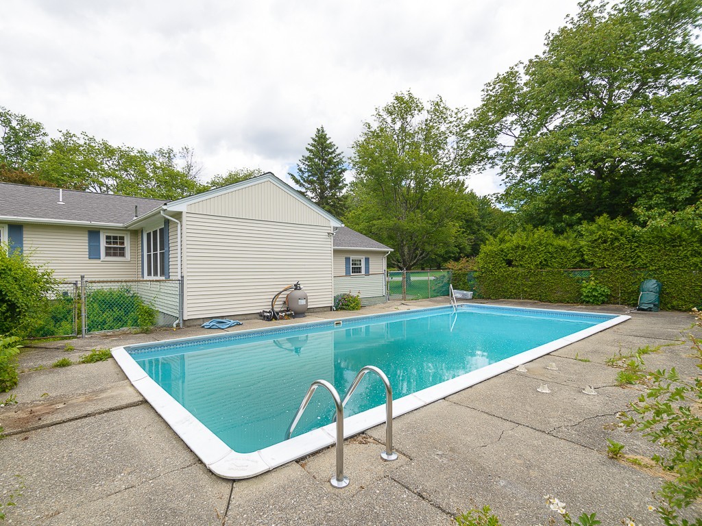 19 8 Lots Road Sutton, MA 01590 - Photo 29 of 30 a view of a backyard with a swimming pool and sitting area