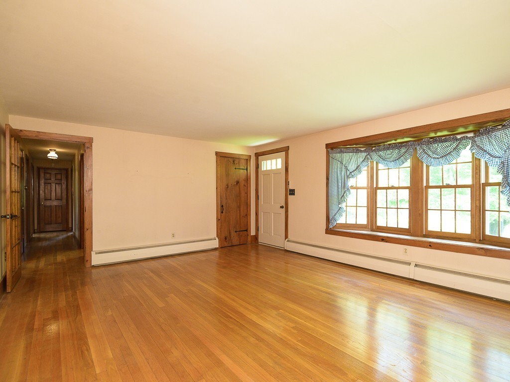 19 8 Lots Road Sutton, MA 01590 - Photo 5 of 30 wooden floor in an empty room with a window