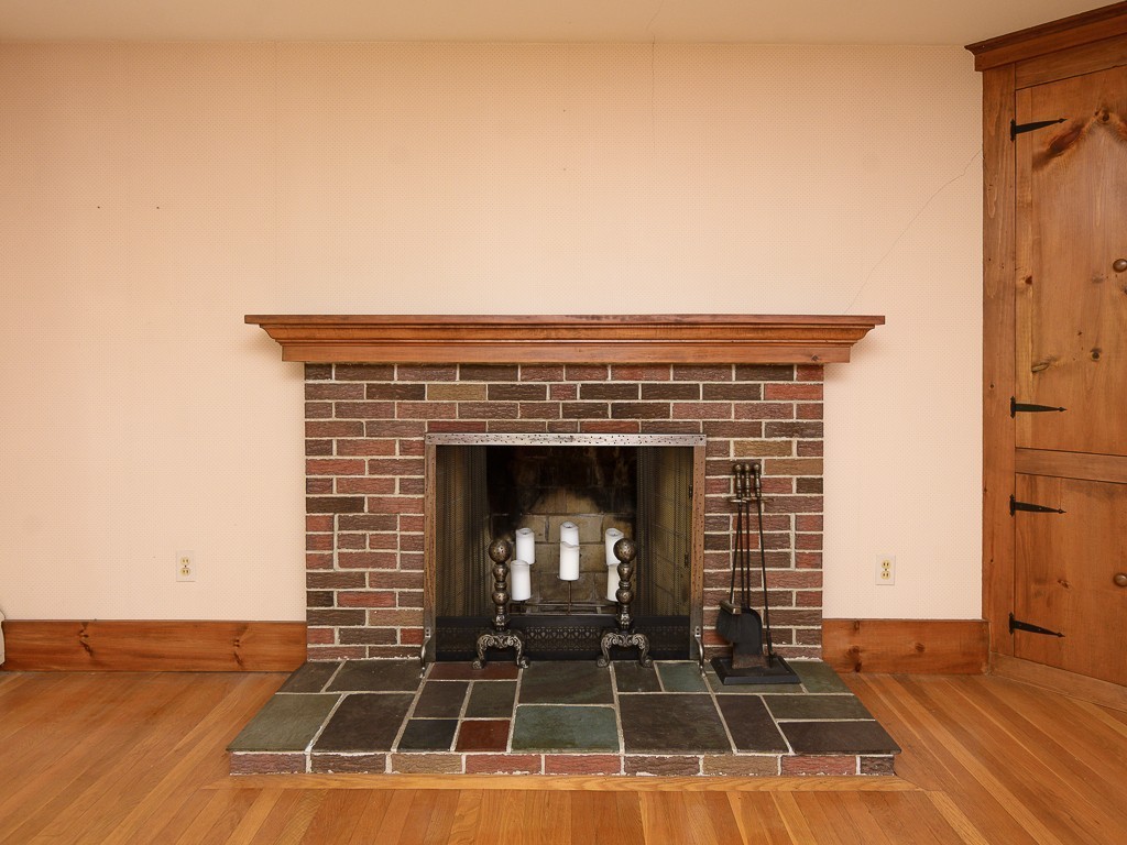 19 8 Lots Road Sutton, MA 01590 - Photo 6 of 30 a view of a room with wooden floor and a fireplace