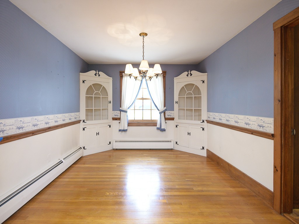19 8 Lots Road Sutton, MA 01590 - Photo 7 of 30 a view of an empty room with window and wooden floor