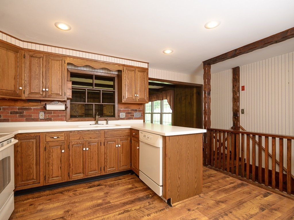 19 8 Lots Road Sutton, MA 01590 - Photo 9 of 30 a kitchen with stainless steel appliances granite countertop a stove and a sink