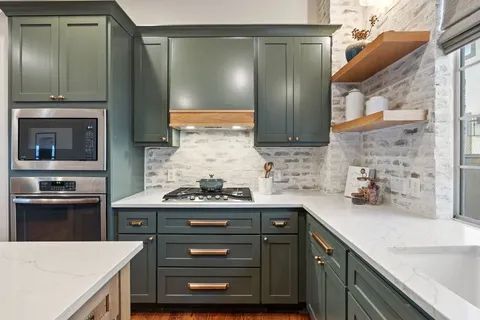 a view of a dining room with a table and chairs