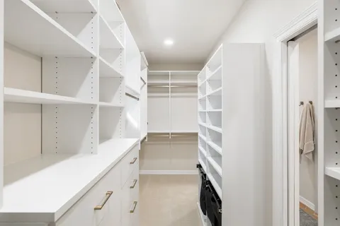 a view of a livingroom with furniture and windows