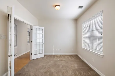 an empty room with windows