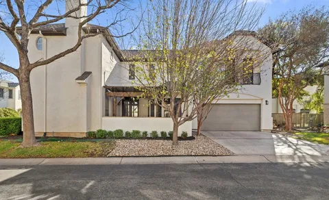 a view of a chairs and table in the patio