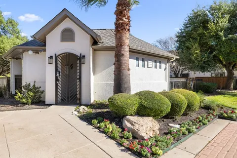 a view of backyard of house with outdoor seating