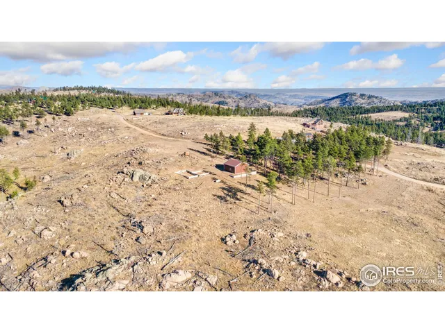 a view of an ocean beach and mountain