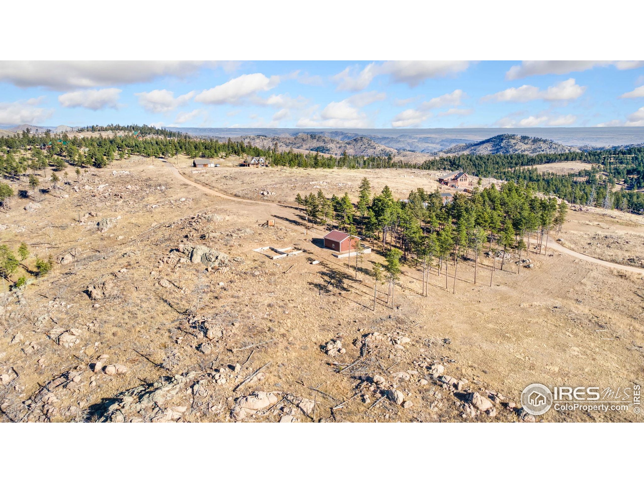 3434 Davis Ranch Road Bellvue, CO 80512 - Photo 15 of 30 a view of an ocean beach and mountain