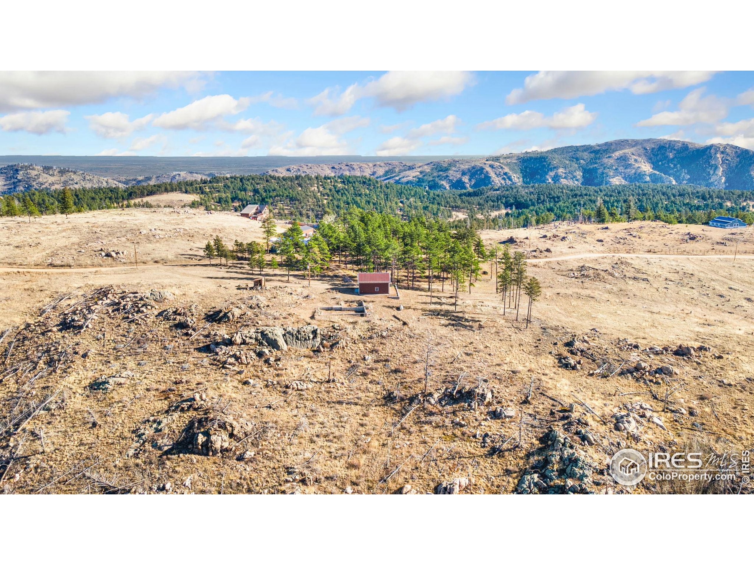 3434 Davis Ranch Road Bellvue, CO 80512 - Photo 16 of 30 a view of an ocean beach and mountain