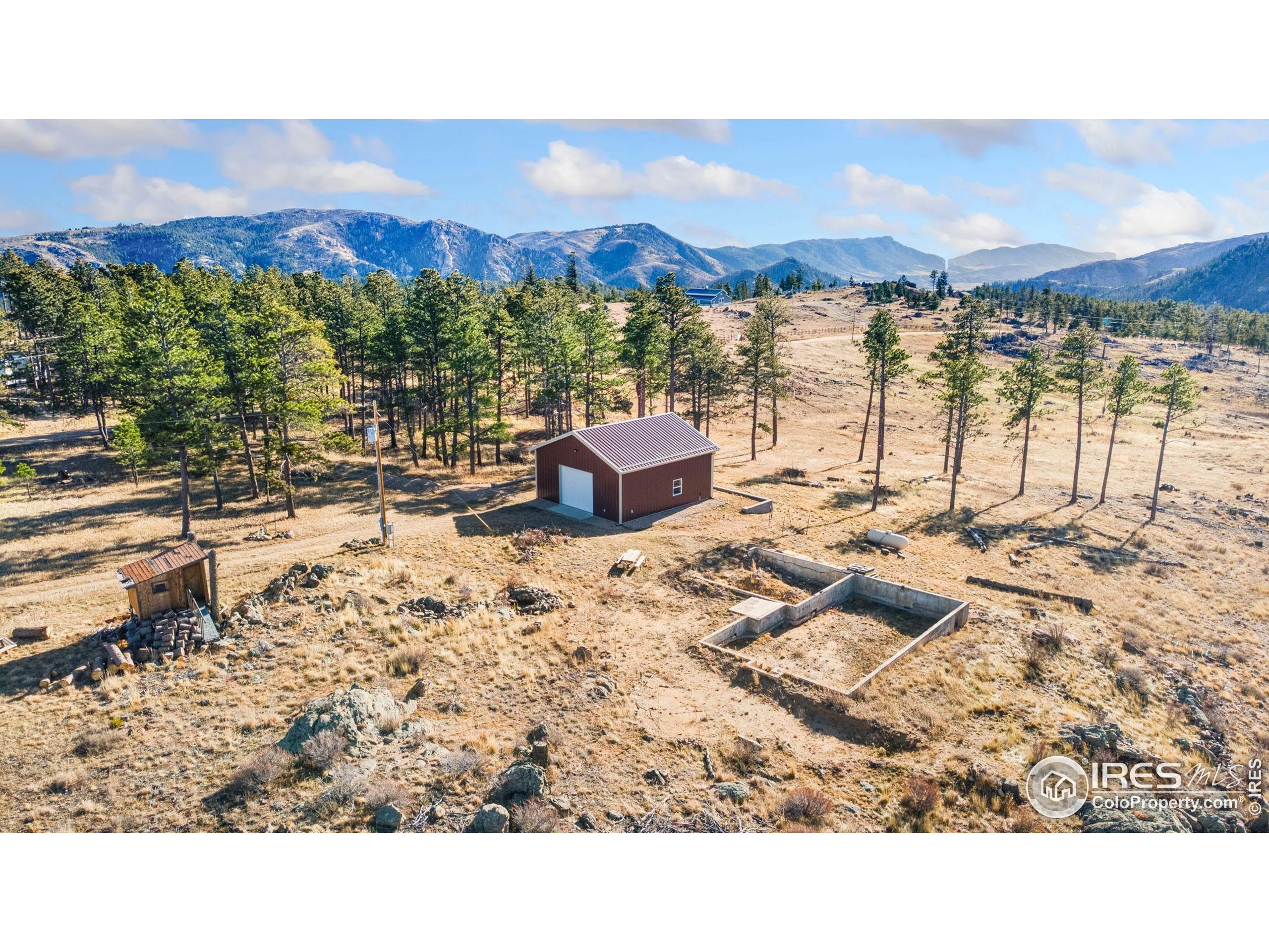 3434 Davis Ranch Road Bellvue, CO 80512 - Photo 17 of 30 a view of a city with an ocean beach
