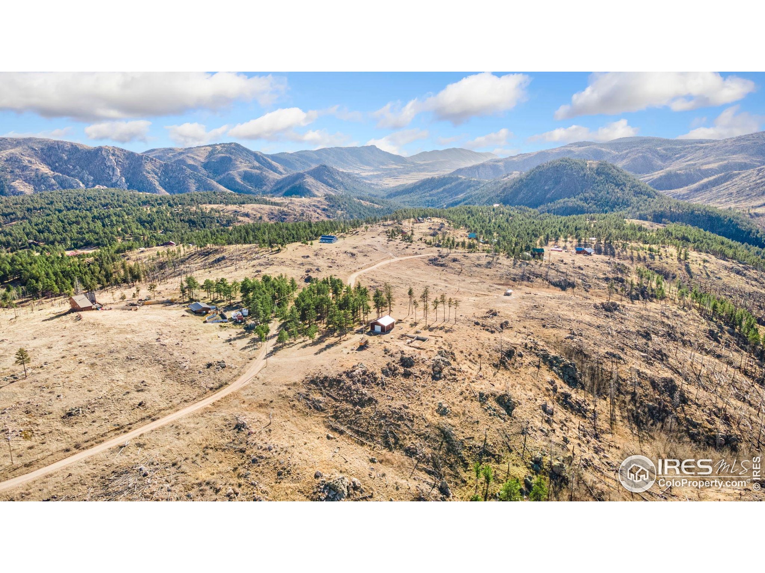 3434 Davis Ranch Road Bellvue, CO 80512 - Photo 2 of 30 a view of a sky from mountains