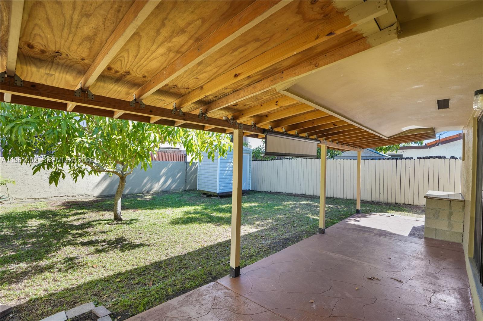 6227 Southwest 135th Avenue Miami, FL 33183 - Photo 19 of 24 a backyard of a house with a garden and plants