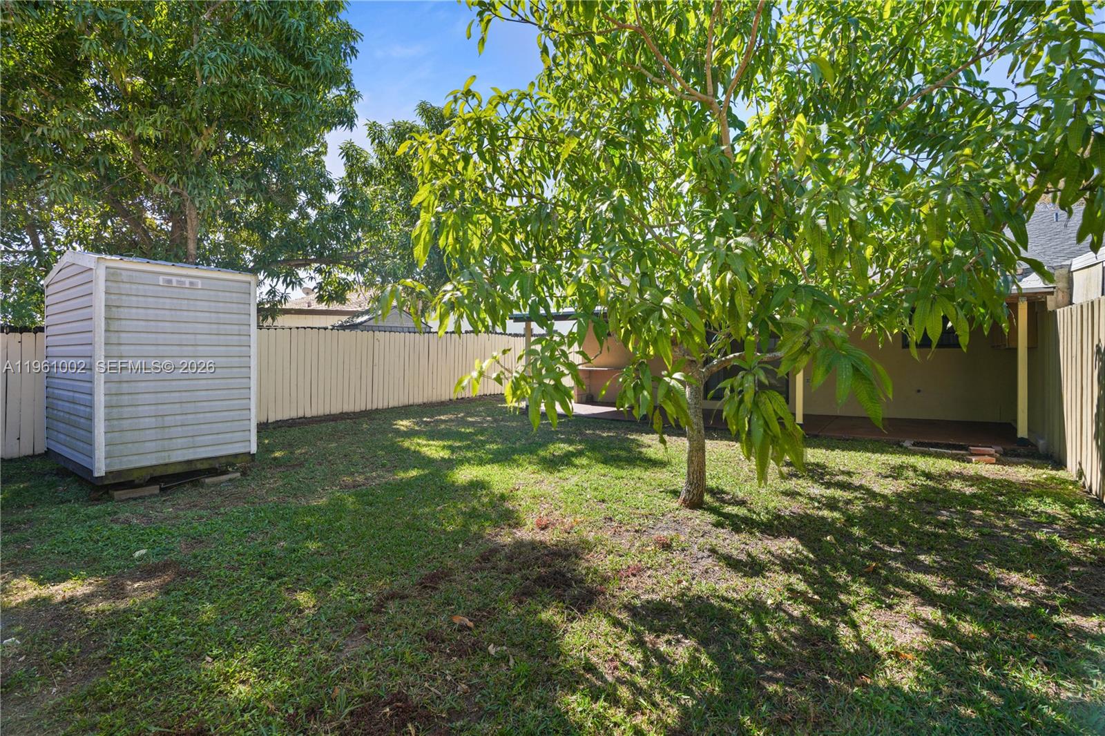 6227 Southwest 135th Avenue Miami, FL 33183 - Photo 21 of 24 a backyard of a house with lots of green space