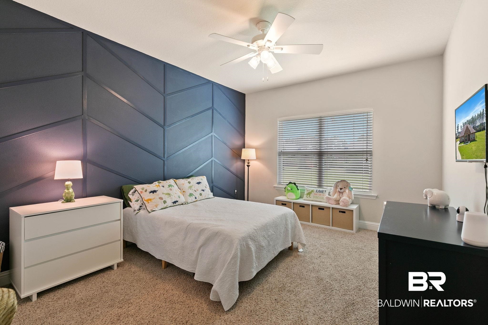 12750 B Jenkins Pit Road Daphne, AL 36527 - Photo 46 of 89 Bedroom featuring an accent wall, light colored carpet, and a ceiling fan