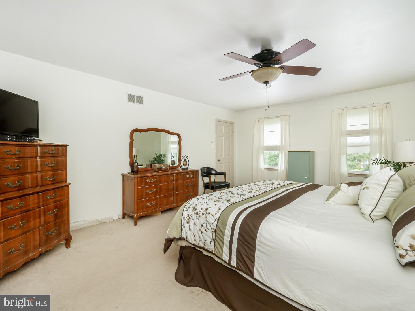 281 Cliveden Drive Newtown, PA 18940 - Photo 27 of 35 a bedroom with a bed and a flat screen tv