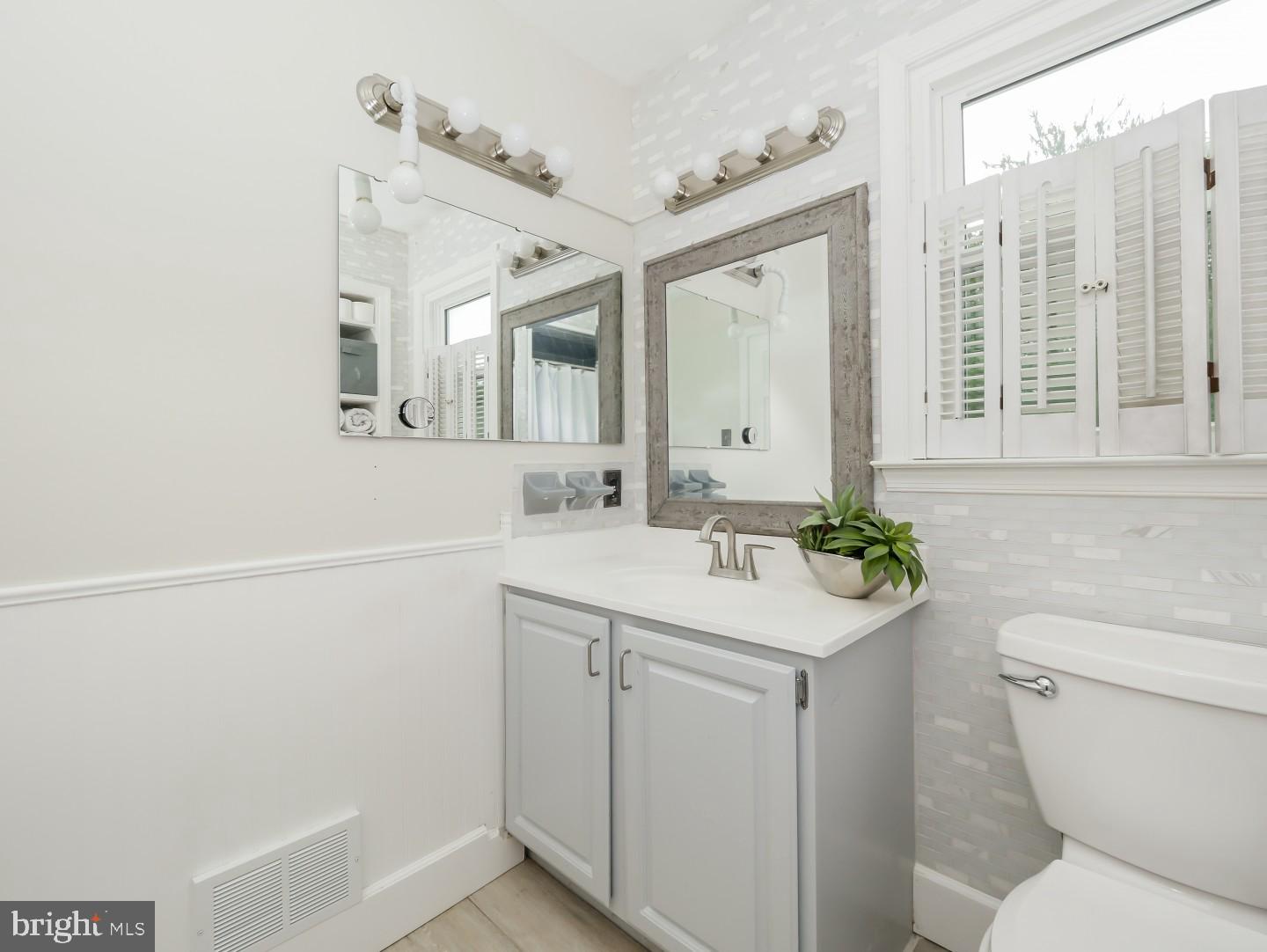 281 Cliveden Drive Newtown, PA 18940 - Photo 28 of 35 a bathroom with a sink a toilet and a mirror