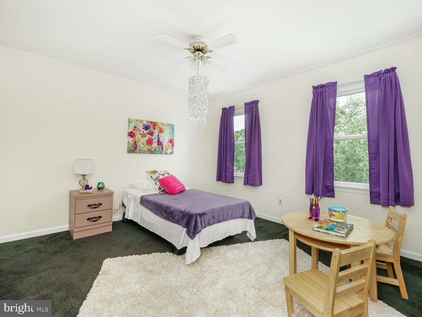 281 Cliveden Drive Newtown, PA 18940 - Photo 29 of 35 a bedroom with a bed and a chandelier