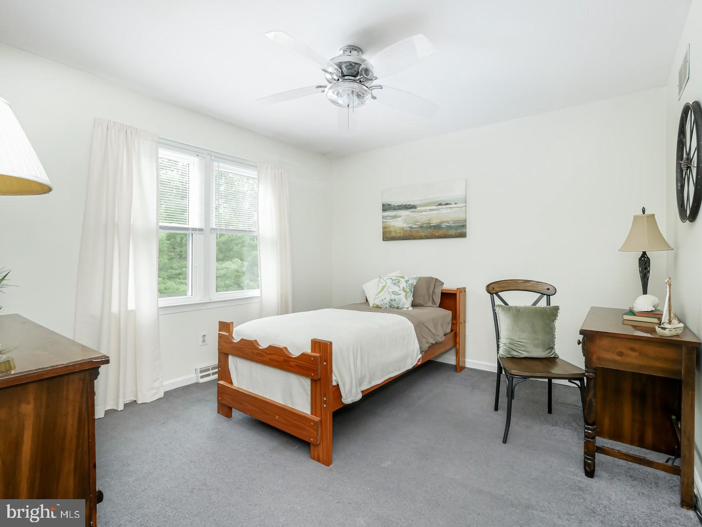 281 Cliveden Drive Newtown, PA 18940 - Photo 30 of 35 a bedroom with a bed chair and window