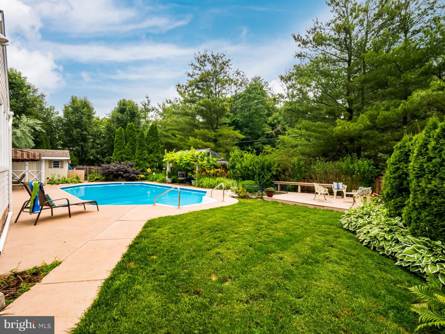 281 Cliveden Drive Newtown, PA 18940 - Photo 4 of 35 a view of a swimming pool with a yard