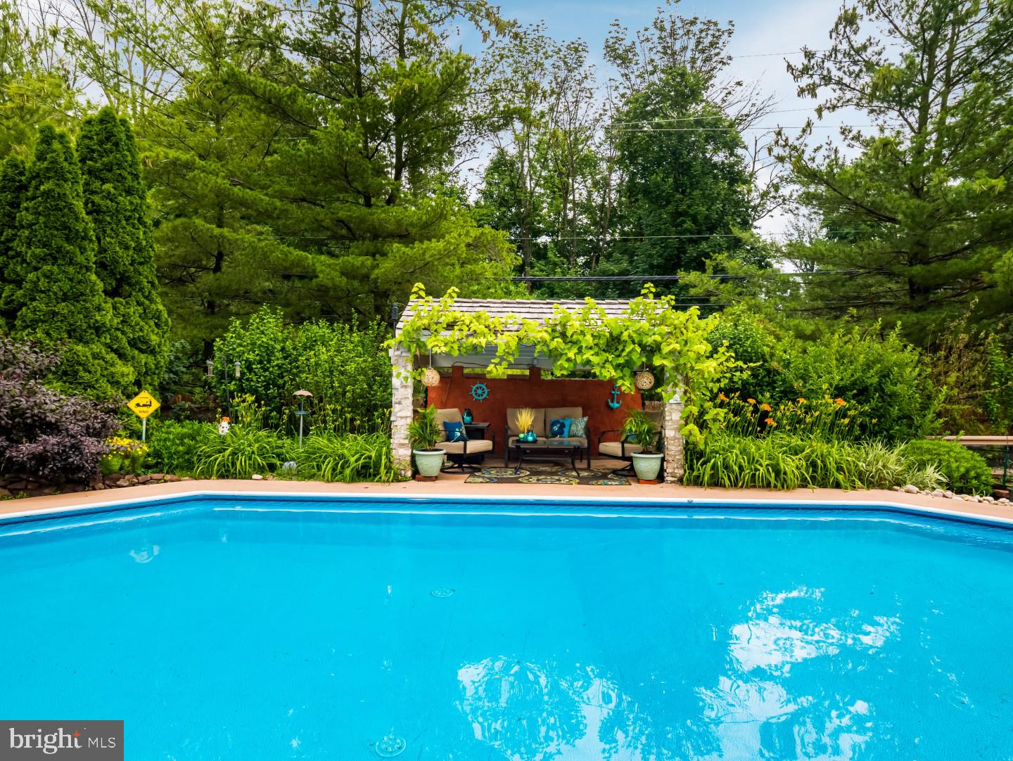 281 Cliveden Drive Newtown, PA 18940 - Photo 7 of 35 a view of a swimming pool with an outdoor seating and a yard
