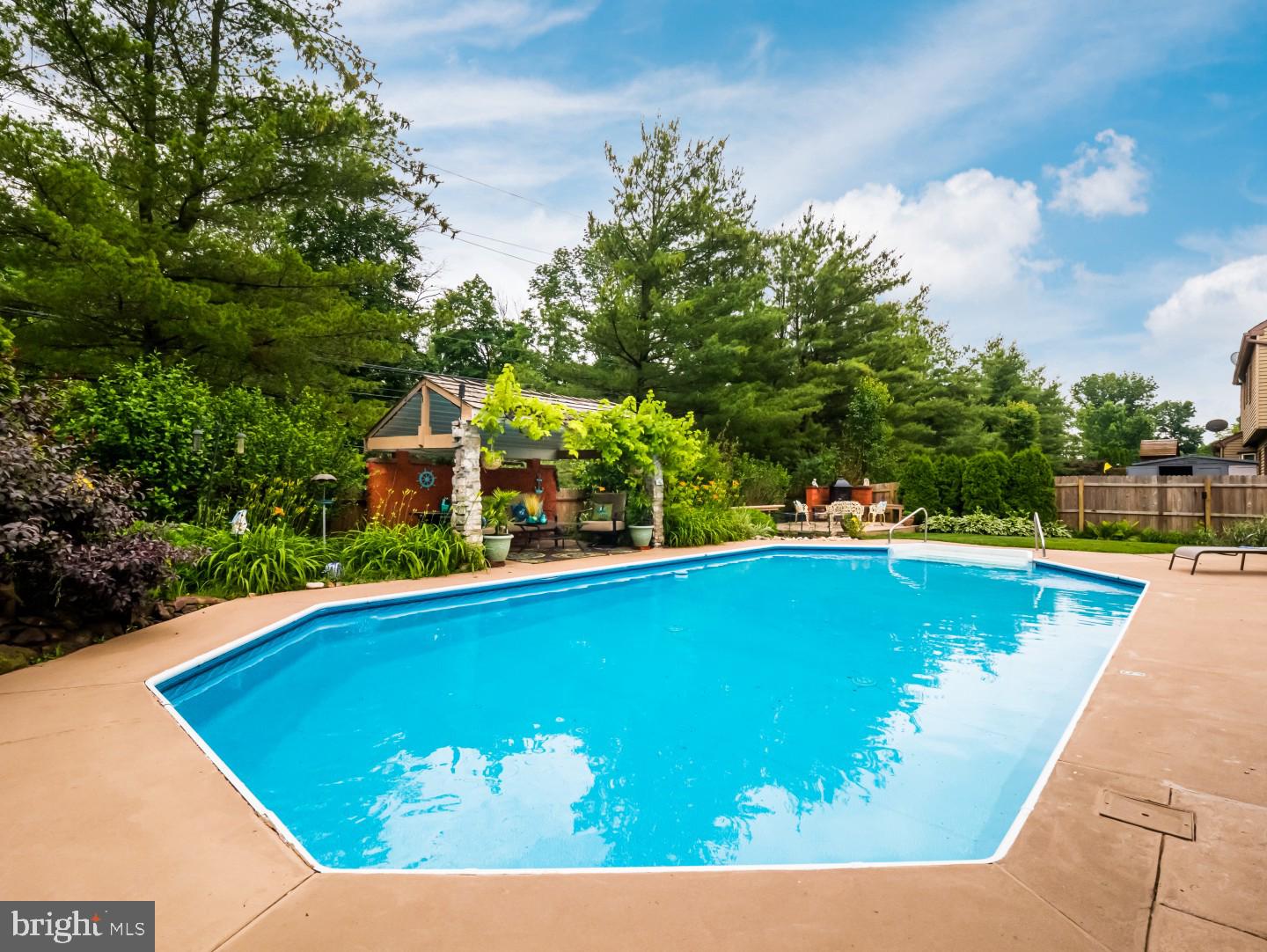 281 Cliveden Drive Newtown, PA 18940 - Photo 8 of 35 a view of a swimming pool with an outdoor seating