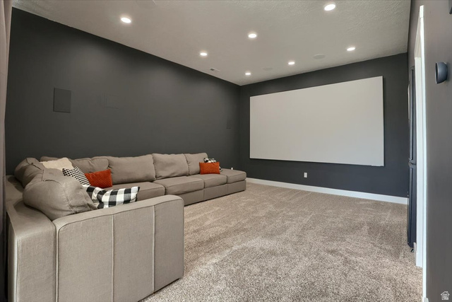 828 South Deer Road Tooele, UT 84074 - Photo 20 of 51 Dedicated media room featuring a large projection screen and dark accent walls