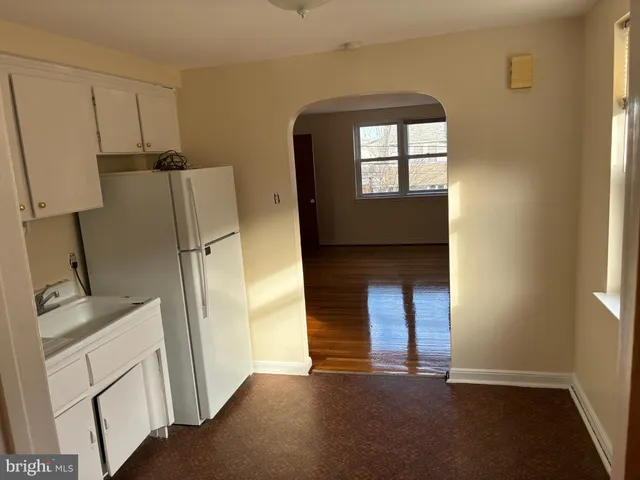 a view of a kitchen with a sink and a window