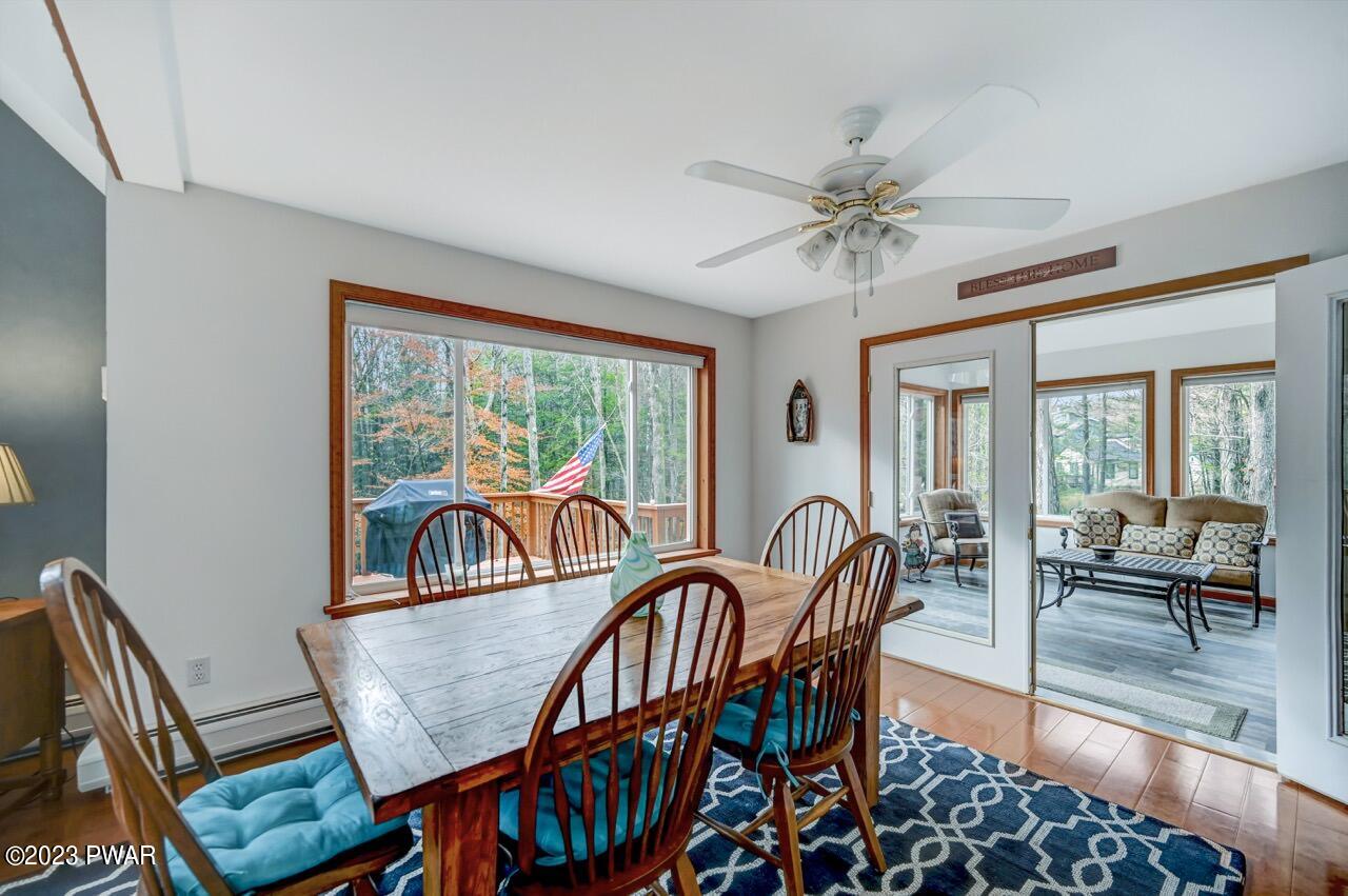 1294 Brookfield Road Lake Ariel, PA 18436 - Photo 14 of 75 a dining room with furniture a chandelier and wooden floor