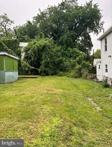 a view of a pool with a yard