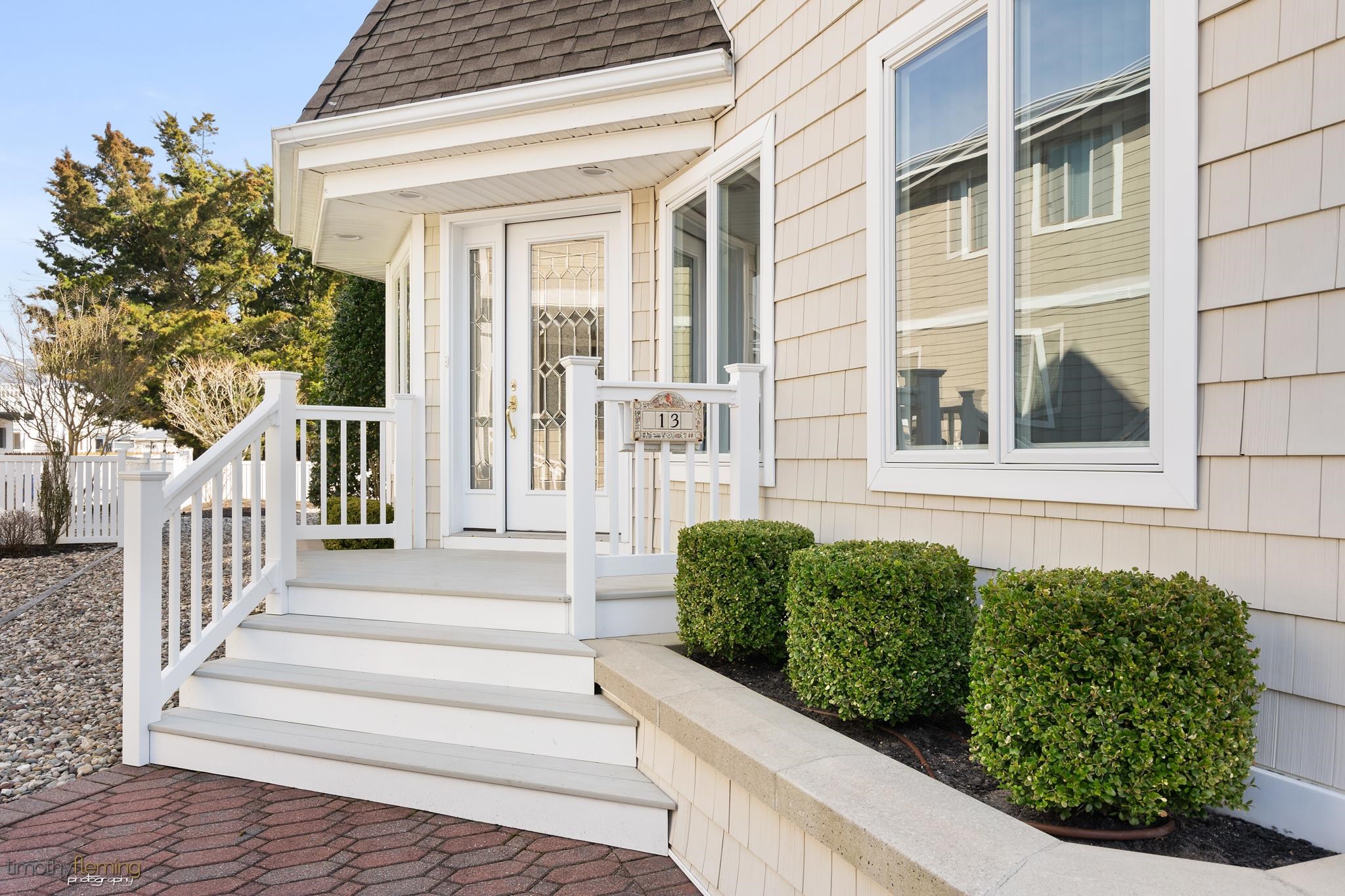 13 12th Street Avalon, NJ 08202 - Photo 2 of 24 a view of a house with a window and stairs