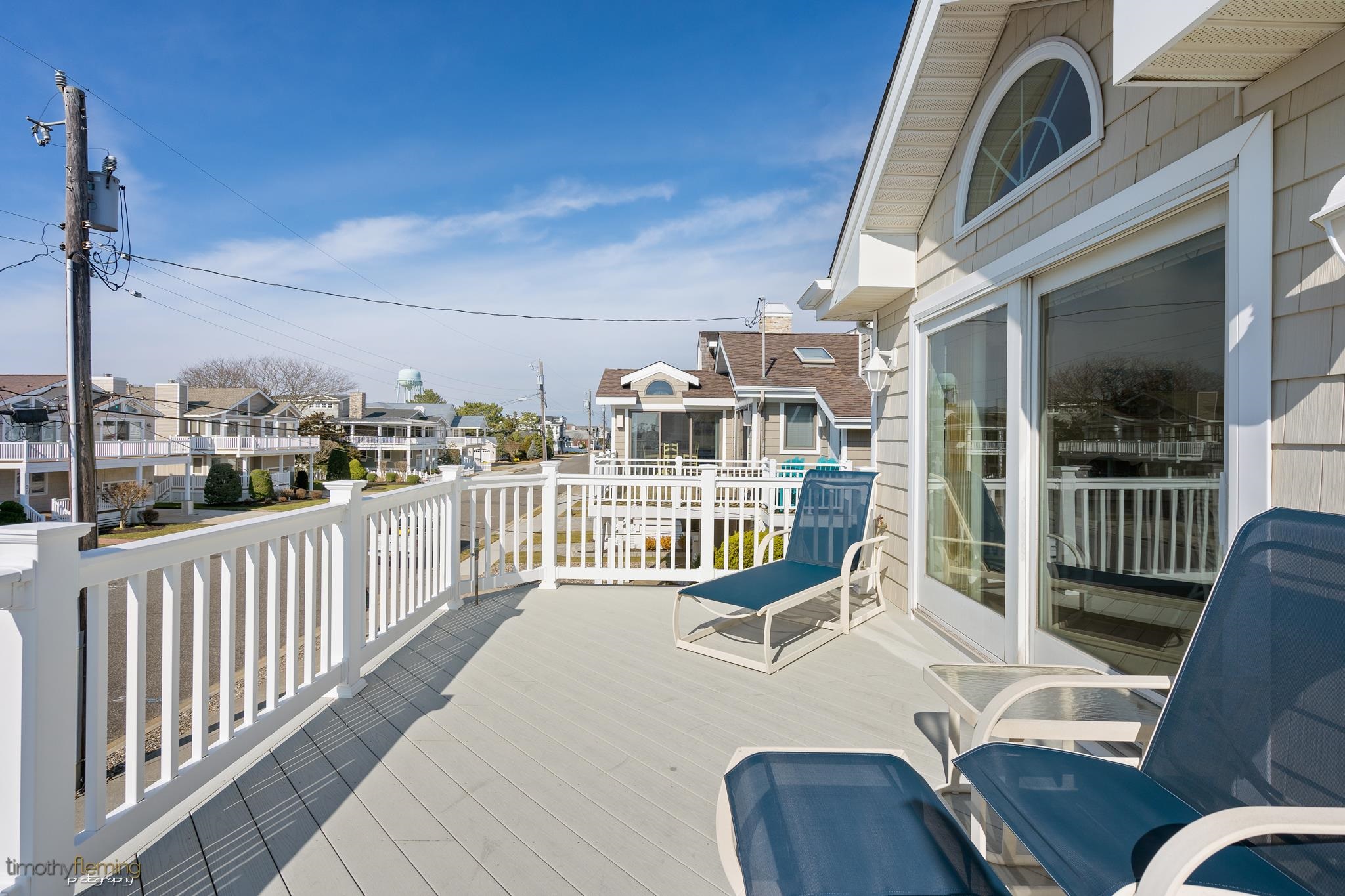 13 12th Street Avalon, NJ 08202 - Photo 22 of 24 a view of a balcony with furniture