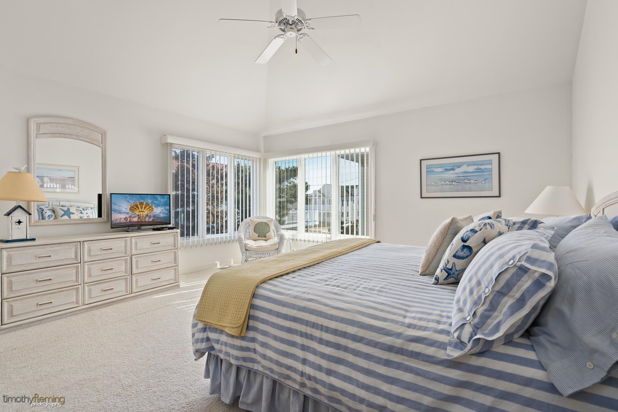 13 12th Street Avalon, NJ 08202 - Photo 9 of 24 a bedroom with a bed a couch and large window