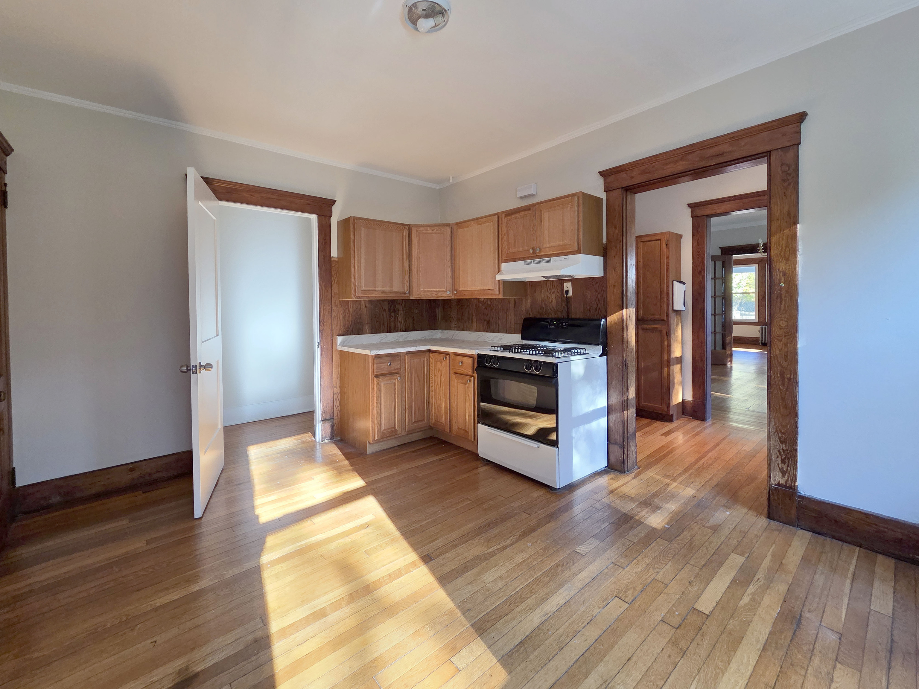 302 Lexington Avenue New Haven, CT 06513 - Photo 13 of 24 a kitchen with granite countertop a stove top oven and cabinets