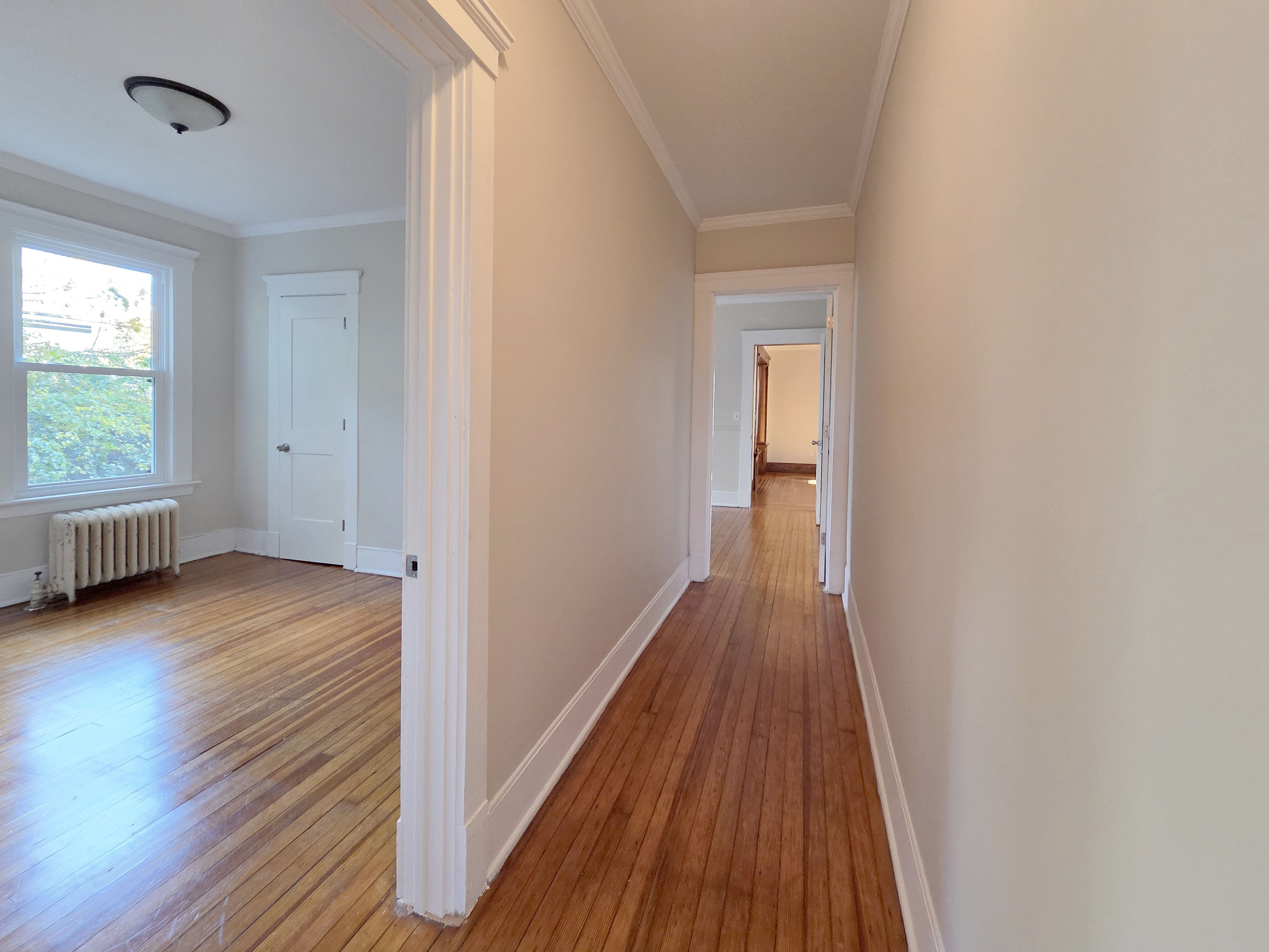 302 Lexington Avenue New Haven, CT 06513 - Photo 18 of 24 a view of a room with wooden floor and a window