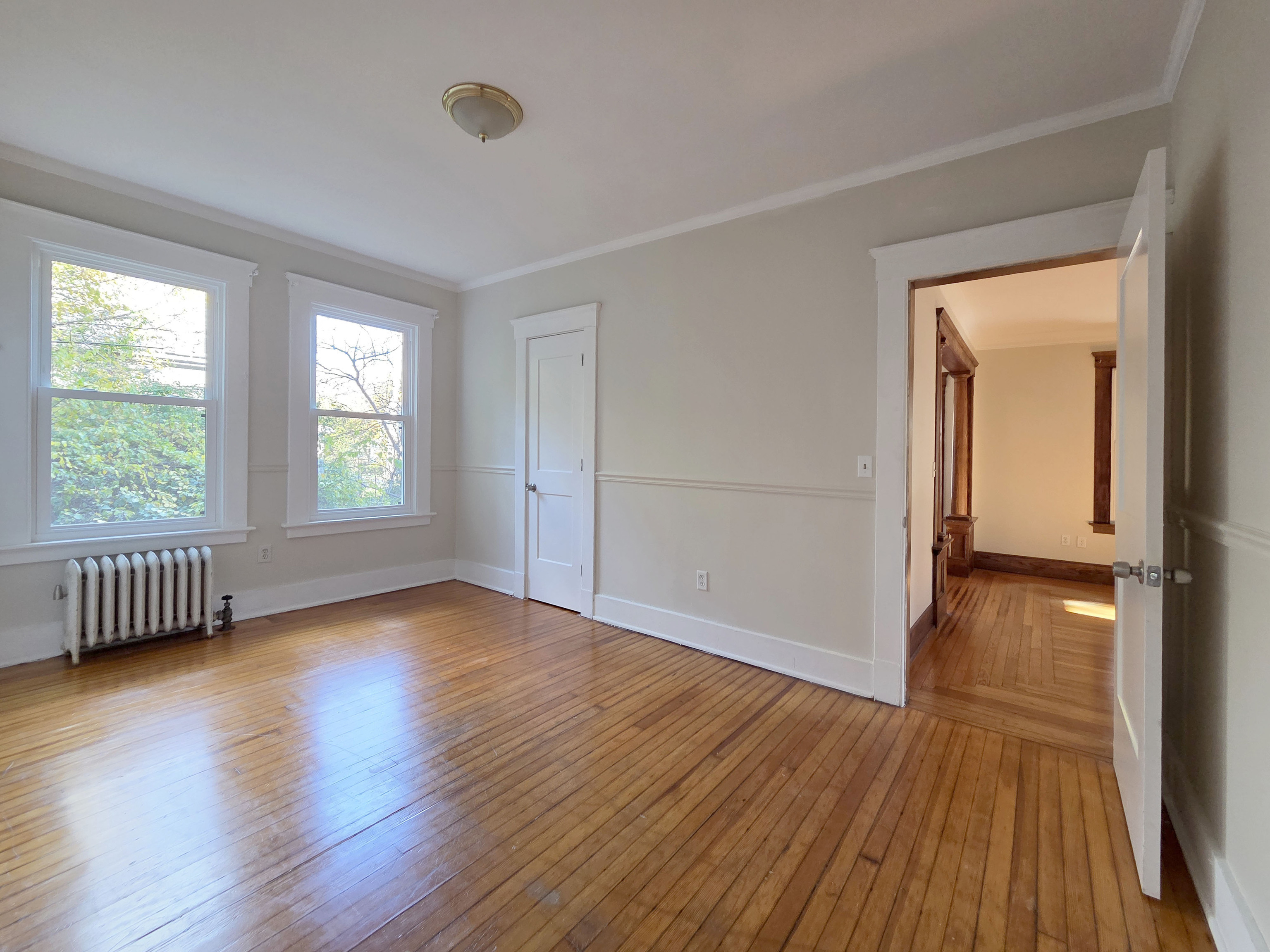 302 Lexington Avenue New Haven, CT 06513 - Photo 20 of 24 an empty room with wooden floor and windows