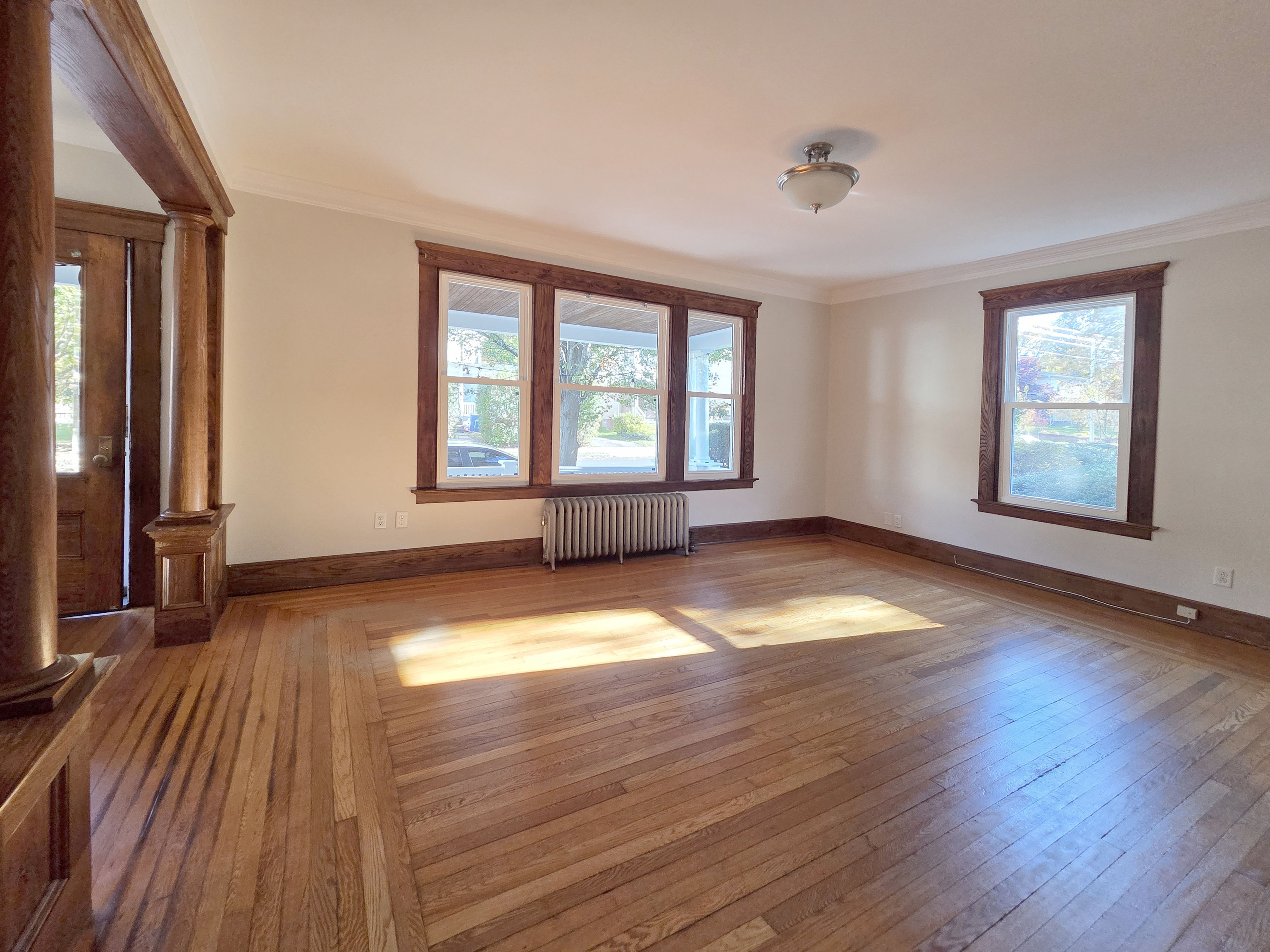 302 Lexington Avenue New Haven, CT 06513 - Photo 22 of 24 an empty room with wooden floor and windows